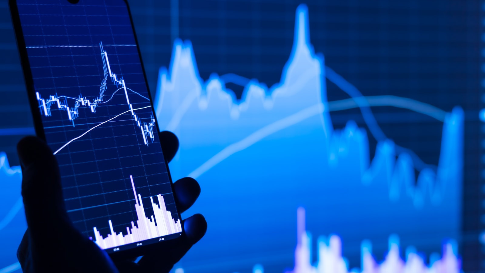 A person checking a stock chart on a smartphone - a realistic strategy guide to earning 10-15% annual returns from a European base in 2026.